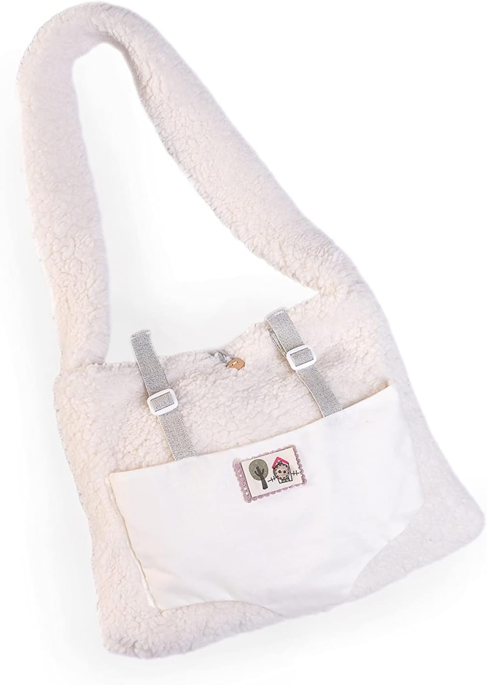 Recién Nacida Lea con bolso portabebé de borreguillo